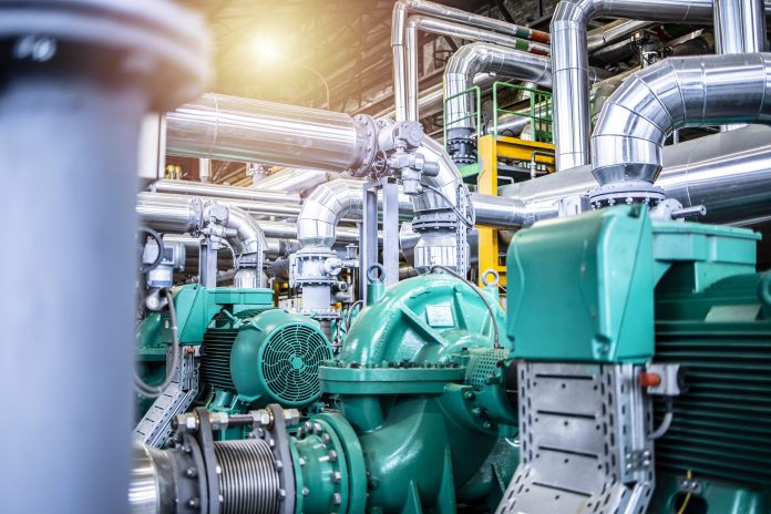 Interior view of an oil and gas petrochemical refinery plant with pipeline and valves. Industrial fuel production.